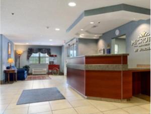 a large kitchen with a large counter top at Microtel Inn & Suites by Wyndham Gardendale in Gardendale