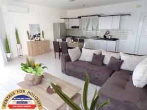 A kitchen or kitchenette at HELLENIC ESTATE SUITES