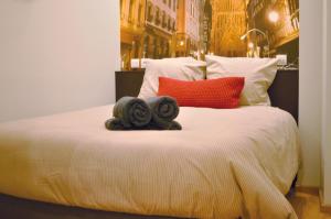 Postel nebo postele na pokoji v ubytování Les Appartements de l'Epine