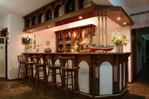 a bar with a wooden island with a model boat on it at Afroditi in Panormos Skopelos