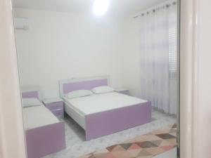 Postel nebo postele na pokoji v ubytování Guesthouse Anila