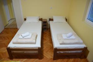 Postel nebo postele na pokoji v ubytování Dora Apartment