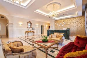a living room with a couch and a table at BO Hotel Palazzo in Poreč