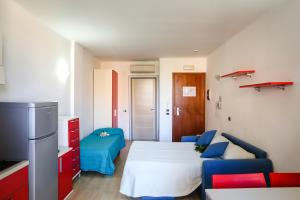 Кровать или кровати в номере Residence Mediterraneo