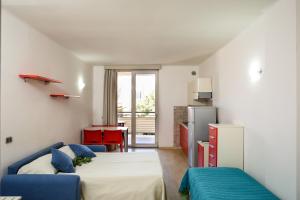 Кровать или кровати в номере Residence Mediterraneo