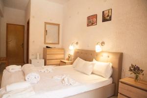 Postel nebo postele na pokoji v ubytování Gioma Hotel