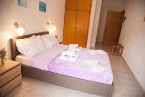 Postel nebo postele na pokoji v ubytování Gioma Hotel