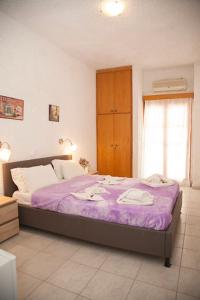 Postel nebo postele na pokoji v ubytování Gioma Hotel