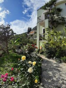 a house with flowers in front of it at Vila Maljevik in Sutomore