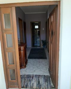 a hallway with a door leading into a room at Vila Maljevik in Sutomore