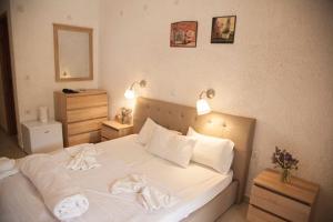 Postel nebo postele na pokoji v ubytování Gioma Hotel
