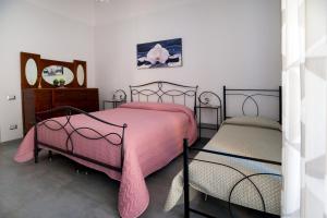 Säng eller sängar i ett rum på Casa vacanza Alla marina - Cetara