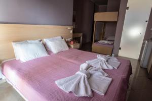Posteľ alebo postele v izbe v ubytovaní Oniro Rooms & Suites