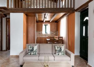 a living room with a couch and a table at Villa Margarita in Anafonítria