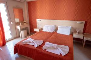 Postel nebo postele na pokoji v ubytování Oniro Rooms & Suites