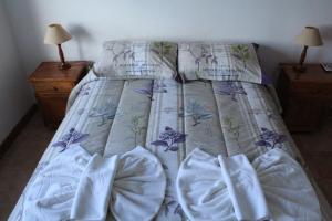 Una cama o camas en una habitación de Hotel Arquimedes