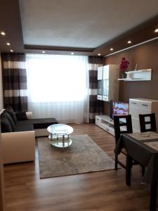 a living room with a couch and a table at Apartment TT6 in Trnava