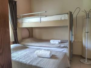 two bunk beds with towels on them in a room at Luxury Seaside House in Mades Heraklion in Agia Pelagia