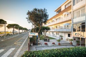 an empty street in front of a building at Yachting residence in Lignano Sabbiadoro