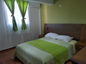 Ένα ή περισσότερα κρεβάτια σε δωμάτιο στο Figaro Hotel Samana