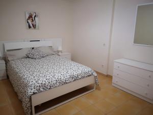A bed or beds in a room at Bahía Meloneras