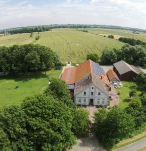 an aerial view of a large house in a field at Ferienhof Gerdes an der Nordsee in Wangerland