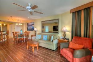a living room with a couch and a table at Horizon at 77th Avenue North by Palmetto Vacations in Myrtle Beach