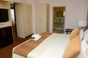 Katil atau katil-katil dalam bilik di leclub resort hotel