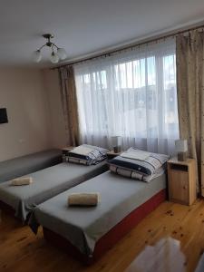 Postel nebo postele na pokoji v ubytování O.W.W Janosik