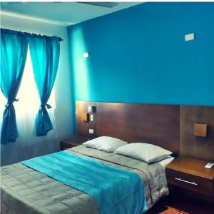 Ένα ή περισσότερα κρεβάτια σε δωμάτιο στο Figaro Hotel Samana