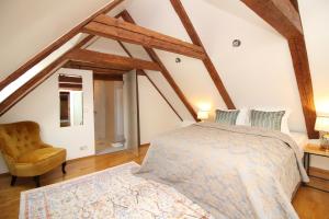 A bed or beds in a room at Tallinn City Apartments - Old Town