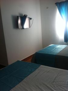 Ένα ή περισσότερα κρεβάτια σε δωμάτιο στο Figaro Hotel Samana