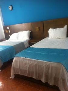 Ένα ή περισσότερα κρεβάτια σε δωμάτιο στο Figaro Hotel Samana