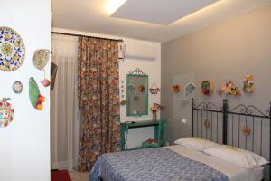 Posteľ alebo postele v izbe v ubytovaní cocciu d'amuri