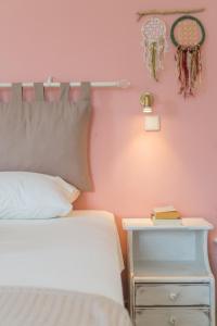 a bedroom with a bed and a nightstand next to a bed and a basketball at Kassiani Studios in Plakias