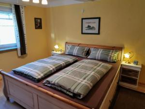 Ένα ή περισσότερα κρεβάτια σε δωμάτιο στο Ferienhaus vom Bahratal