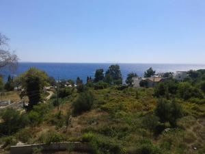 a view of the ocean from a hill at Hotel Afrodite in Dhërmi
