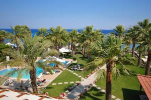 an aerial view of a resort with palm trees and a pool at My Marina Select Hotel in Datca
