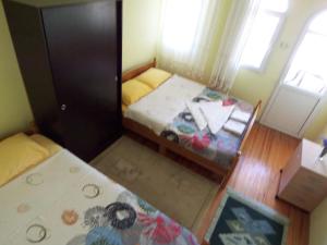 Кровать или кровати в номере izmir Tatil Evi Beach Resort Seferihisar