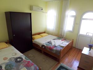 Кровать или кровати в номере izmir Tatil Evi Beach Resort Seferihisar