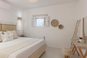 Postel nebo postele na pokoji v ubytování Amalgam Homes Paros