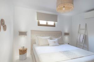 Postel nebo postele na pokoji v ubytování Amalgam Homes Paros