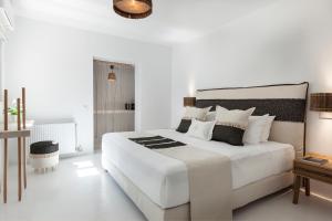 Postel nebo postele na pokoji v ubytování Amalgam Homes Paros