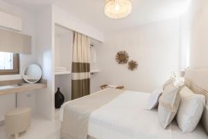 Postel nebo postele na pokoji v ubytování Amalgam Homes Paros