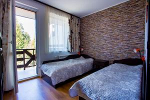 מיטה או מיטות בחדר ב-Apartment IVA - Iglika 2
