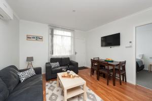 a living room with a couch and a table at 125 Milton in Milton