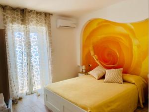 Postel nebo postele na pokoji v ubytování B&B Di Fiore