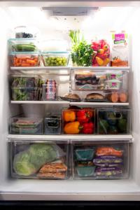 a refrigerator filled with lots of fruits and vegetables at Comfortable Luxury Studio in Los Angeles