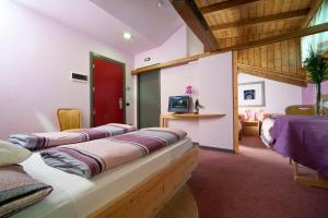 TV a/nebo společenská místnost v ubytování Hotel Marzia