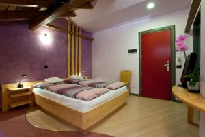 Postel nebo postele na pokoji v ubytování Hotel Marzia